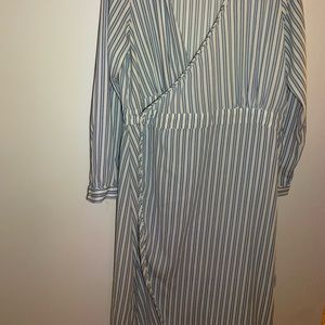 light blue and white striped dress with cleavage and a slit